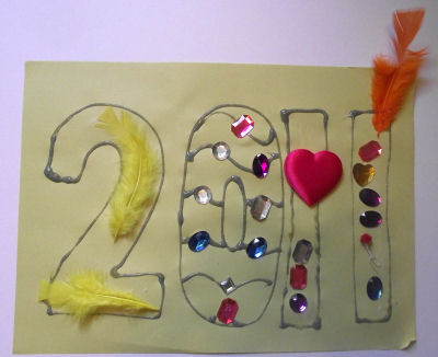 2011 collage with feathers and jewels