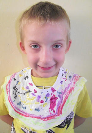Sam models his collar necklace