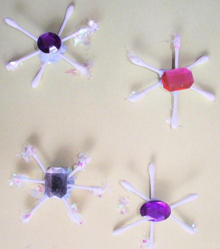 Cotton bud snowflakes on the wall
