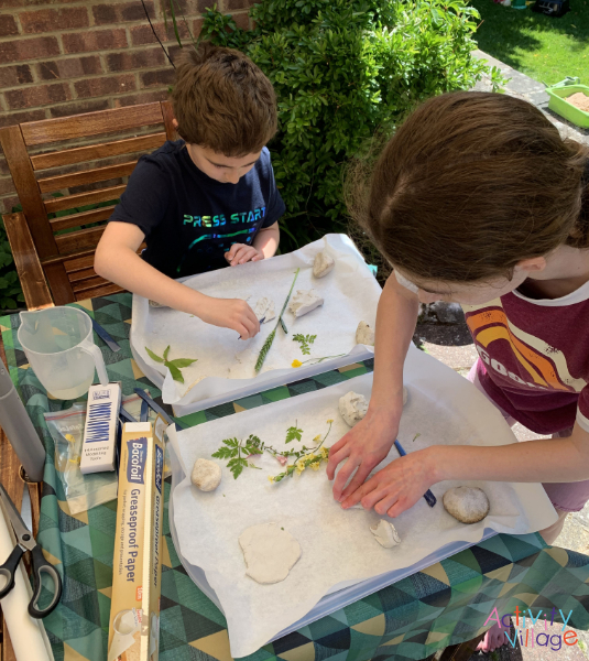 Working outside with the leaves and clay