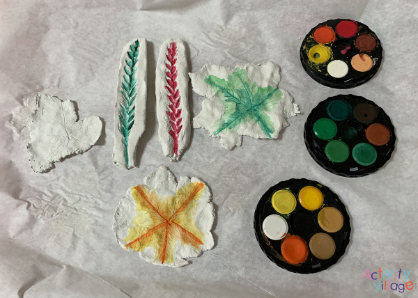 Painting the imprints with watercolours