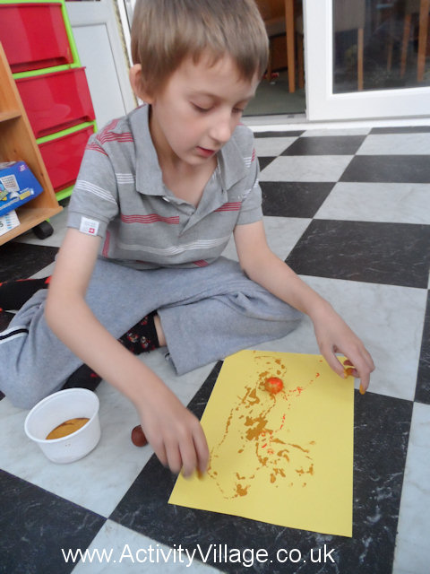 Sam engrossed in his conker painting