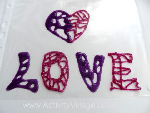 Glitter glue window display - our pictures drying